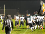 Woodland players celebrate Josiah Graham's game-winning 32-yard field goal with 1 minute left in a 34-31 victory Friday over Hockinson. Woodland is now 3-0 in 2A Greater St. Helens League play.