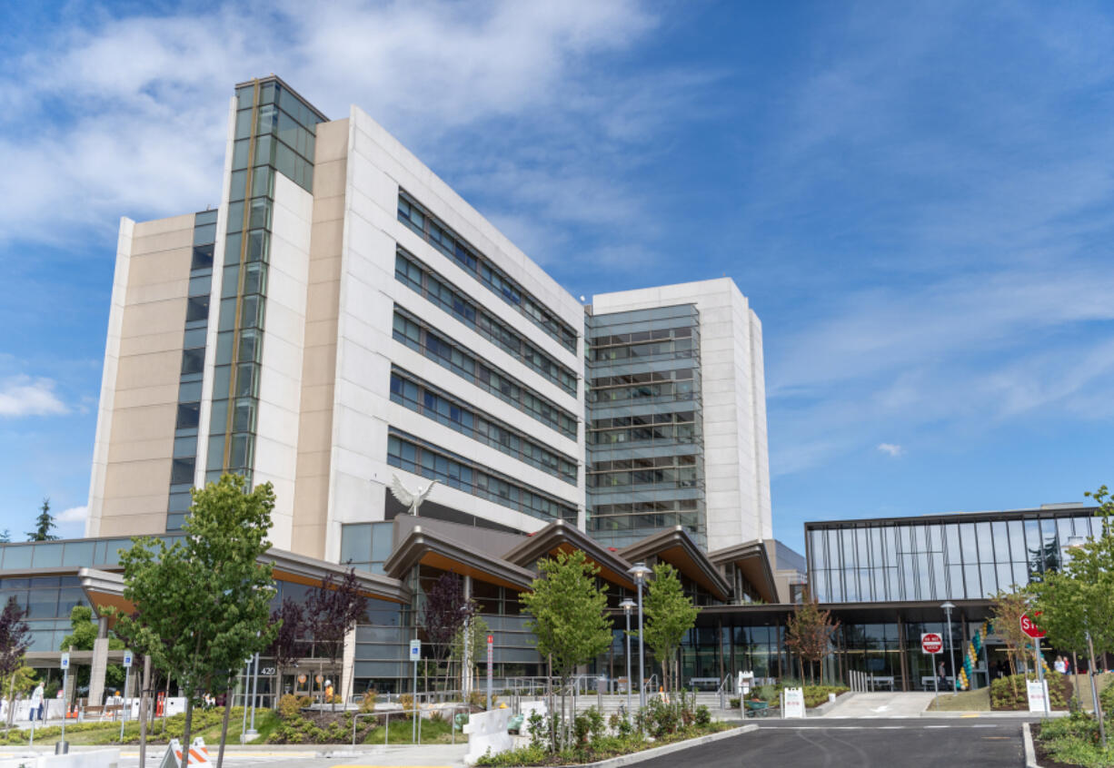 A new emergency room building, at right, sits next to the existing hospital June 28 at PeaceHealth Southwest Medical Center in Vancouver.