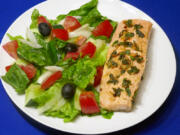 Greek salad with salmon sauteed in an olive oil, lemon and garlic sauce.