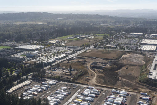 HP has submitted an update to its master plan for a campus in east Vancouver bear the intersection of 192 Avenue and First Street, pictured here in 2022.  The HP site is on the righthand side of the photo south of the semi parking area. Retail in Lacamas Crossing on the corner started opening earlier this year.