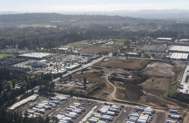 HP has submitted an update to its master plan for a campus in east Vancouver bear the intersection of 192 Avenue and First Street, pictured here in 2022.  The HP site is on the righthand side of the photo south of the semi parking area. Retail in Lacamas Crossing on the corner started opening earlier this year.