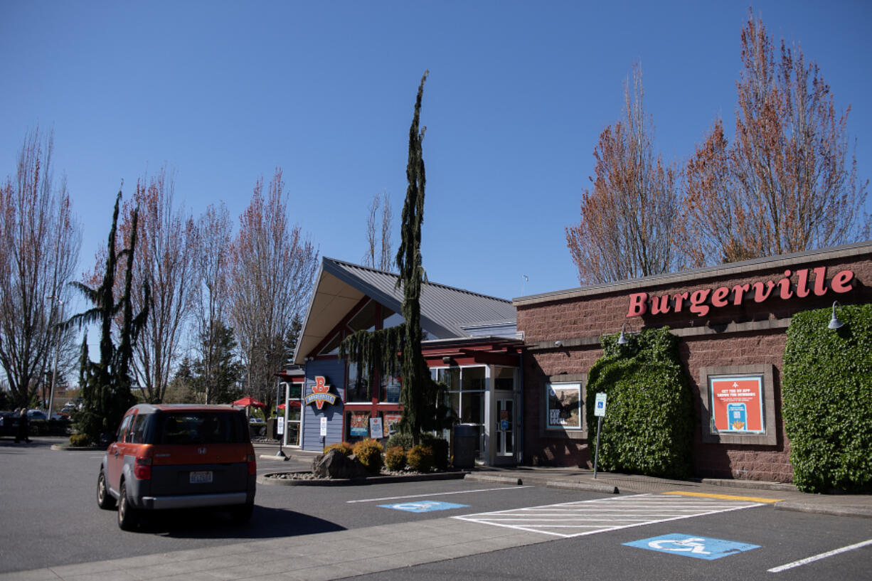 A motorist passes the Salmon Creek Burgerville. The Vancouver company is poised to expand in the coming years.