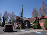 A motorist passes the Salmon Creek Burgerville. The Vancouver company is poised to expand in the coming years.