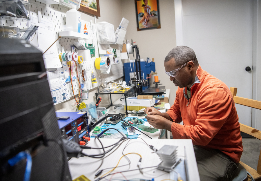 Sustainable Power and Water Engineering Solutions founder Geb Mengistu works on soldering a driver in Mengistu&rsquo;s garage. The company is part of a growing renewable energy job sector here in Clark County.