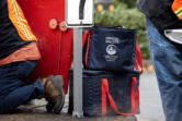 Official ballots are collected by elections officials in secure bags in downtown Vancouver on Monday afternoon, Nov. 4, 2024.