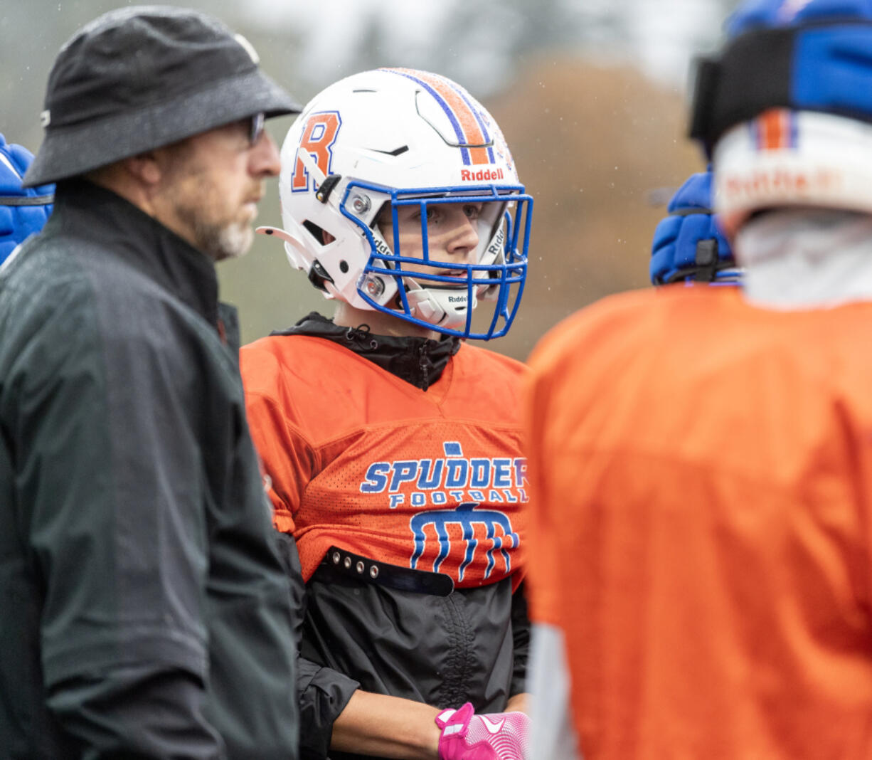 Ridgefield senior Noah Stromberg listens in a huddle at practice Thursday, Oct. 31, 2024, at Ridgefield High School.