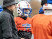 Ridgefield senior Noah Stromberg listens in a huddle at practice Thursday, Oct. 31, 2024, at Ridgefield High School.