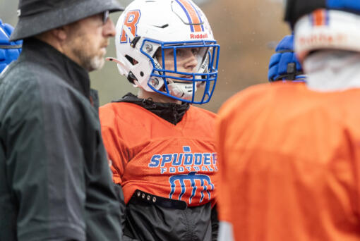 Ridgefield senior Noah Stromberg listens in a huddle at practice Thursday, Oct. 31, 2024, at Ridgefield High School.