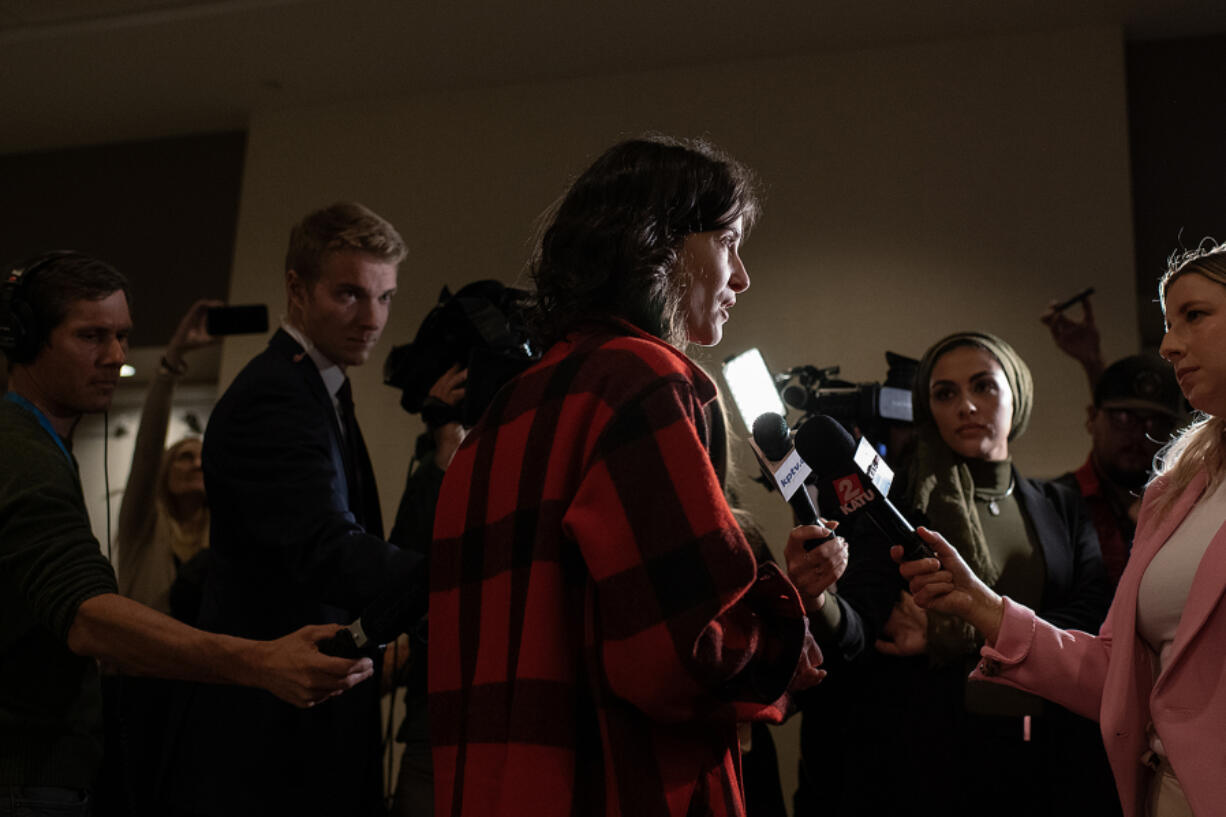 Rep. Marie Gluesenkamp Perez, center, answers questions from the media after appearing at an election night party at the Hilton Vancouver Washington. In 2022, Perez beat Kent by less than 3,000 votes.