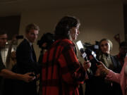 Rep. Marie Gluesenkamp Perez, center, answers questions from the media after appearing at an election night party at the Hilton Vancouver Washington. In 2022, Perez beat Kent by less than 3,000 votes.