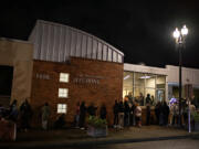 A line of voters stretches outside the Clark County Elections Office in downtown Vancouver Tuesday night.