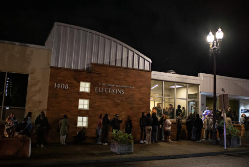 A line of voters stretches outside the Clark County Elections Office in downtown Vancouver Tuesday night.