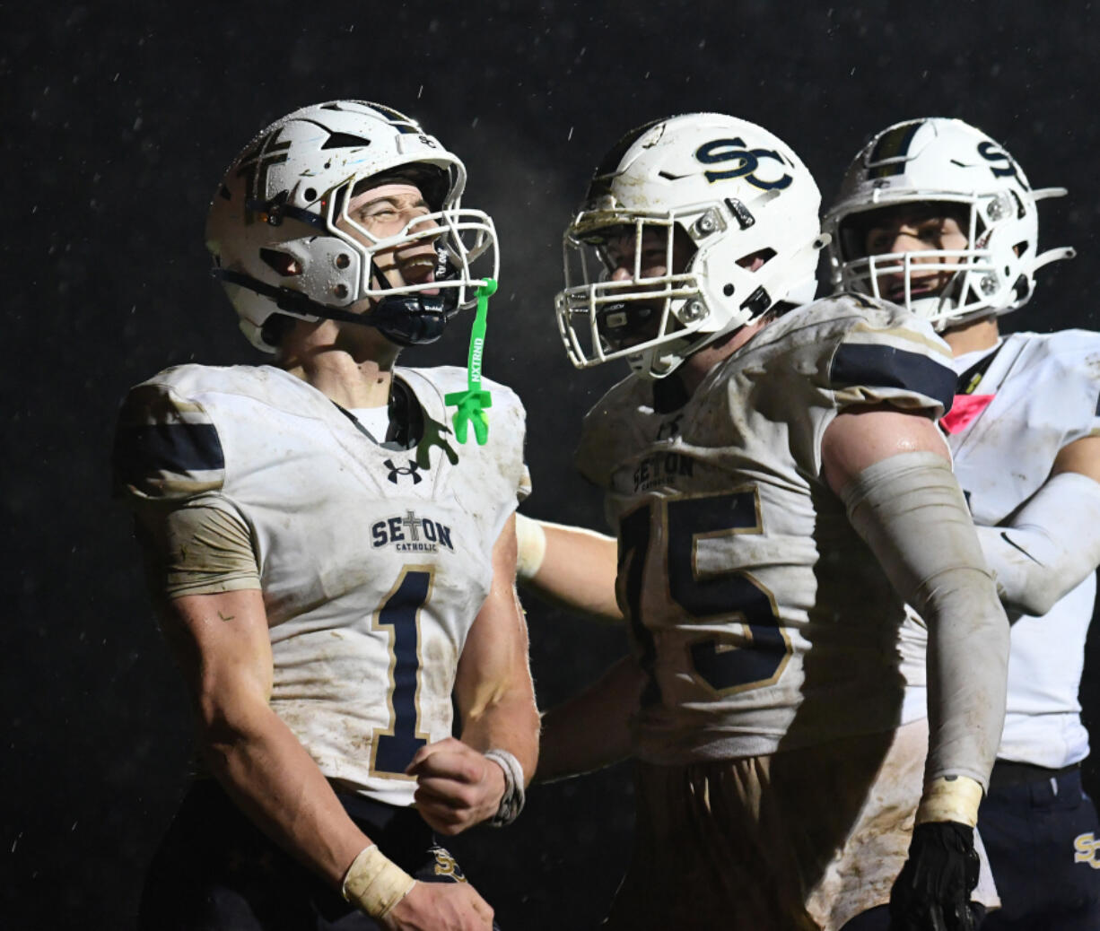 Seton Catholic senior Joe Callerame (1) celebrates a touchdown Friday in the Cougars&rsquo; 29-21 win against La Center at La Center High School.