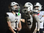 Seton Catholic senior Joe Callerame (1) celebrates a touchdown Friday in the Cougars&rsquo; 29-21 win against La Center at La Center High School.