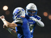 La Center senior Houston Coyle, left, and La Center junior Mason Klein celebrate after Coyle scored a touchdown Friday, Nov. 1, 2024, during La Center’s 29-21 loss to Seton Catholic at La Center High School. Seton won the 1A Trico League Championship with the victory.