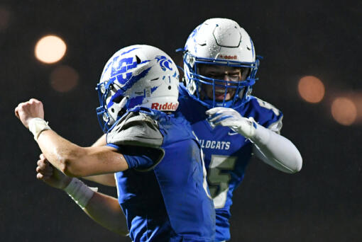 La Center senior Houston Coyle, left, and La Center junior Mason Klein celebrate after Coyle scored a touchdown Friday, Nov. 1, 2024, during La Center’s 29-21 loss to Seton Catholic at La Center High School. Seton won the 1A Trico League Championship with the victory.