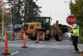 Construction crews work to install a new waterline along Northeast 112th Avenue on Monday morning.