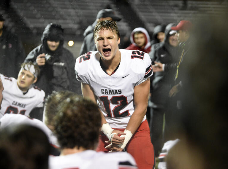 Beau Harlan (12) of Camas celebrates with his teammates after beating Skyview in a 4A Greater St. Helens League football game at Kiggins Bowl on Friday, Nov. 1, 2024.