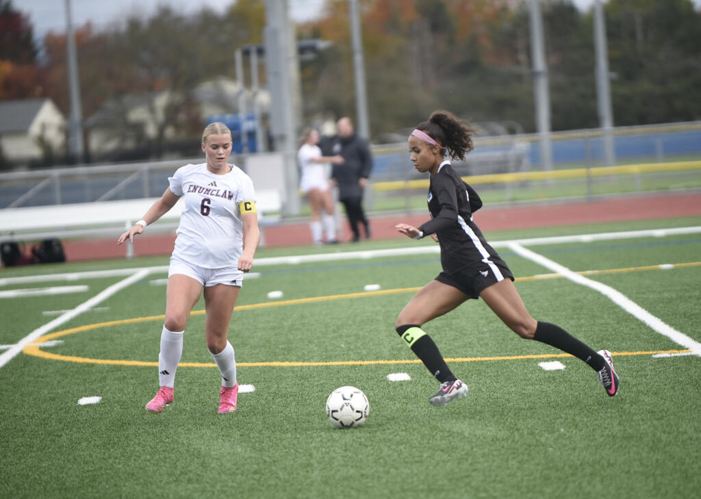 Jaleyah Pitre (right) of Mountain View works against Emma Henshaw (6) of Enumclaw during a 3A bi-district girls soccer match at Mountain View High School on Saturday, Nov. 2, 2024.