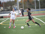 Jaleyah Pitre (right) of Mountain View works against Emma Henshaw (6) of Enumclaw during a 3A bi-district girls soccer match at Mountain View High School on Saturday, Nov. 2, 2024.