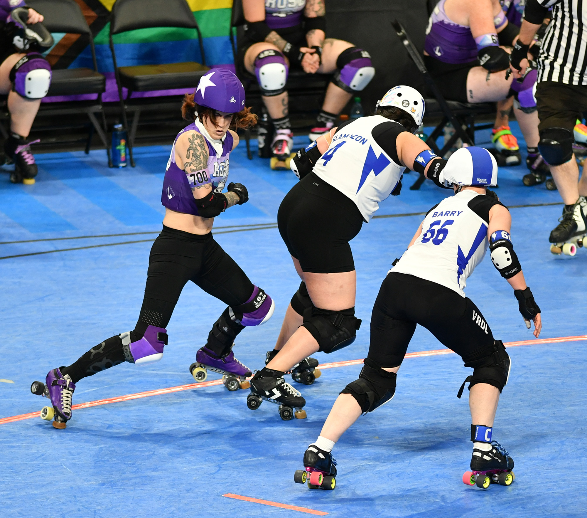 Rose City Rollers jammer Springroll, left, moves around Victoria All Stars blockers Saturday, Nov. 2, 2024, during the Rose City Rollers’ 192-84 win against Victoria All Stars in the semifinals of the Women’s Flat Track Derby Association Global Championships at Veteran’s Memorial Coliseum in Portland.