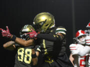 Evergreen wide receiver Josiah Alanis (1) celebrates a first down after catching a pass during the first quarter of a 3A Washington State preliminary playoff football game against Stanwood at McKenzie Stadium in Vancouver, Wash., on Friday, Nov. 8, 2024.