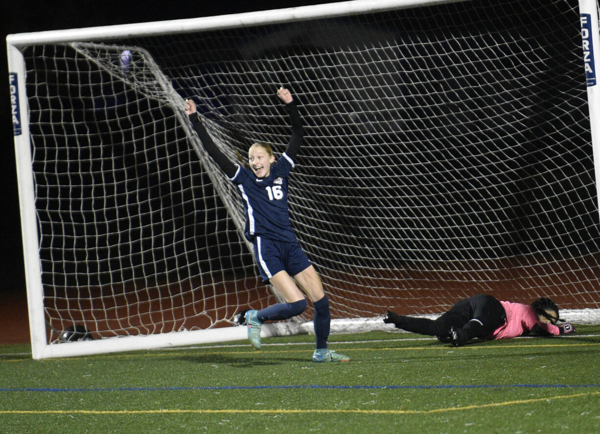 Shaylie Haij (16) of King's Way Christian celebrates after shooting the ball past Rochester goalkeeper Alondra Uribe for a goal against Rochester with teammates Cozette Silva (right) and Addison Bagley (18) during a Class 1A girls soccer district playoff game at King's Way Christian School on Tuesday, Nov. 5, 2024.