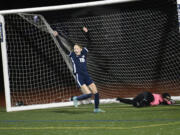 Shaylie Haij (16) of King's Way Christian celebrates after shooting the ball past Rochester goalkeeper Alondra Uribe for a goal against Rochester with teammates Cozette Silva (right) and Addison Bagley (18) during a Class 1A girls soccer district playoff game at King's Way Christian School on Tuesday, Nov. 5, 2024.