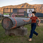 U.S. Rep. Marie Gluesenkamp Perez runs to the finish line while taking part in the women’s obstacle pole event at last summer’s Skamania County Timber Carnival in Stevenson. (Amanda Cowan/The Columbian)