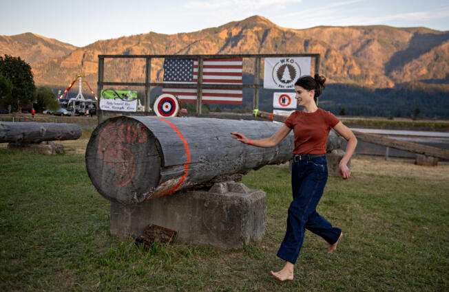 U.S. Rep. Marie Gluesenkamp Perez runs to the finish line while taking part in the women&rsquo;s obstacle pole event at last summer&rsquo;s Skamania County Timber Carnival in Stevenson.