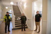 Amanda Cowan/The Columbian
Fort Vancouver National Historic Site Facility Manager Alex Patterson, left, and Superintendent Tracy Fortmann, center, explore the refurbished Building 993 along with Sean Johnson of the Bureau of Indian Affairs. The former U.S. Army barracks used to house as many as 180 soldiers. Now it houses the regional offices of two federal agencies: the Bureau of Indian Affairs and the U.S. Fish and Wildlife Service.