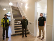 Amanda Cowan/The Columbian
Fort Vancouver National Historic Site Facility Manager Alex Patterson, left, and Superintendent Tracy Fortmann, center, explore the refurbished Building 993 along with Sean Johnson of the Bureau of Indian Affairs. The former U.S. Army barracks used to house as many as 180 soldiers. Now it houses the regional offices of two federal agencies: the Bureau of Indian Affairs and the U.S. Fish and Wildlife Service.