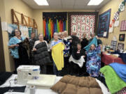 The Clark County Newcomers Quilting Group met at Just For Fun Quilting armed with fleece, portable sewing machines and camaraderie for a special project.