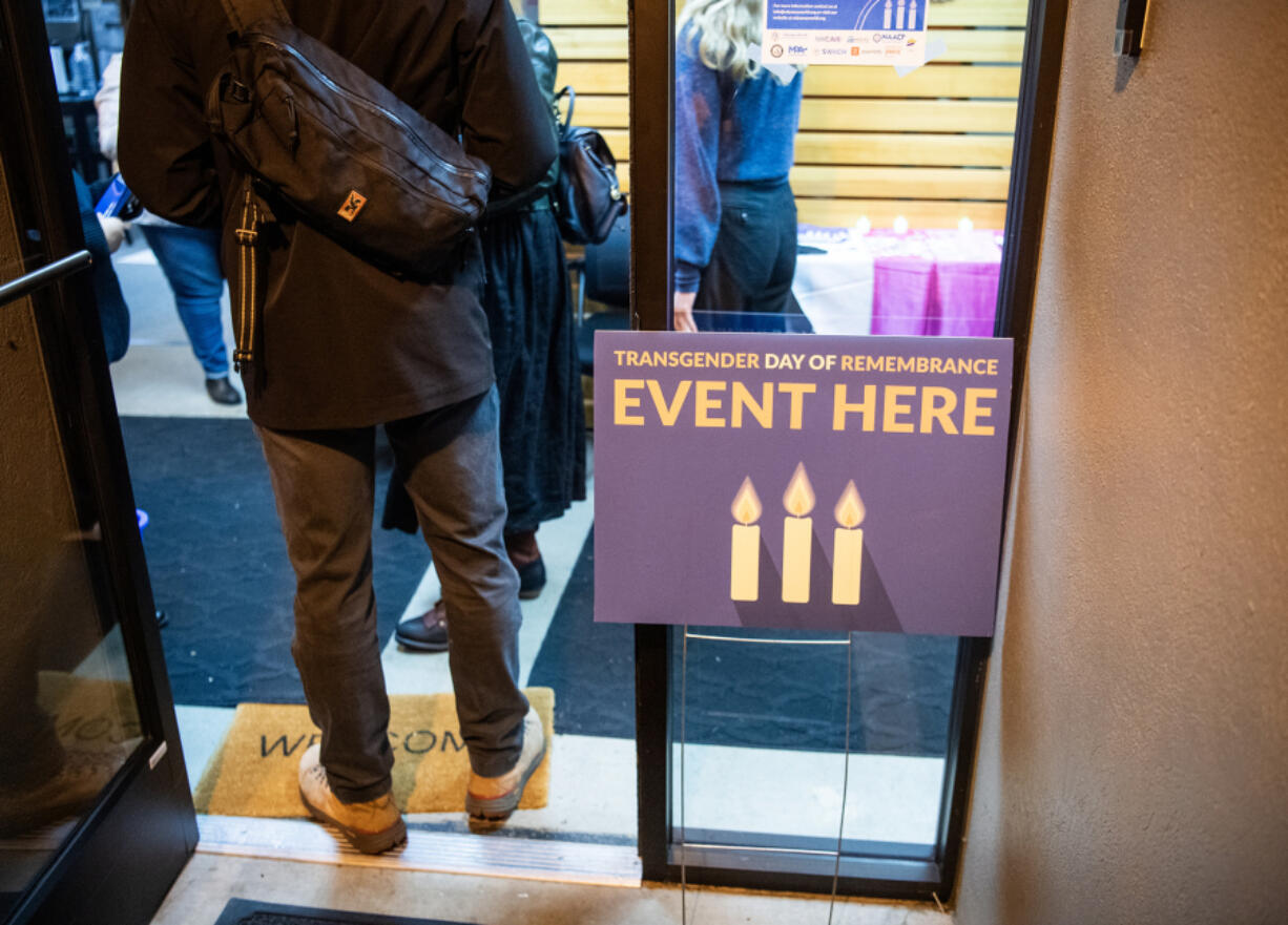 A sign sits at the entrance to Southwest Washington Accountable Community of Health headquarters on Wednesday during a Transgender Day of Remembrance ceremony in downtown Vancouver.