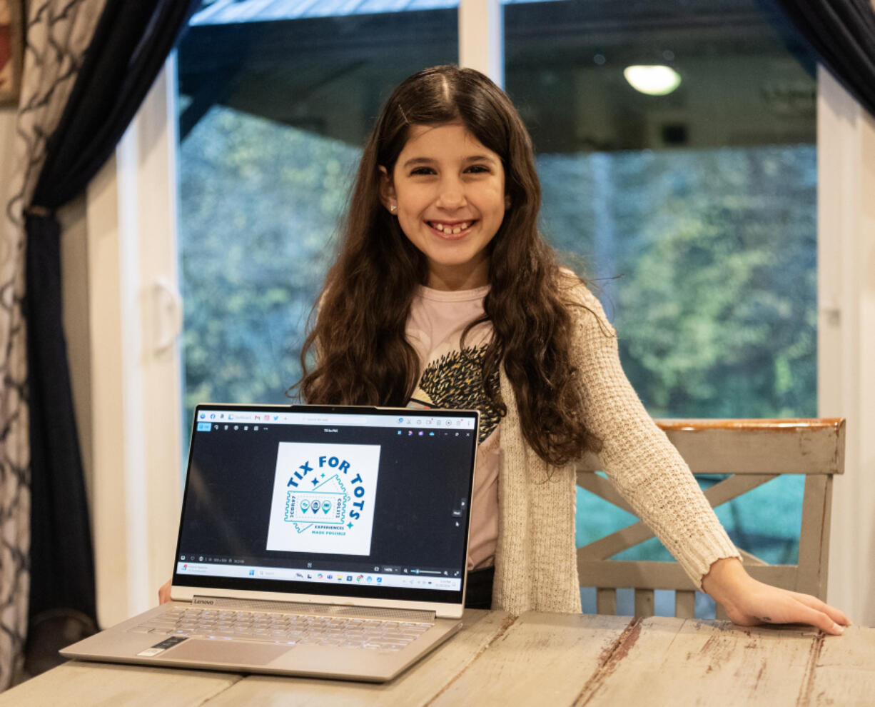 Adele Anaya, 9, stands for a portrait Monday at her home in Brush Prairie. Adele started the Tix for Tots nonprofit to help other kids buy tickets for art experiences like movies, theater and dance performances, and museums.