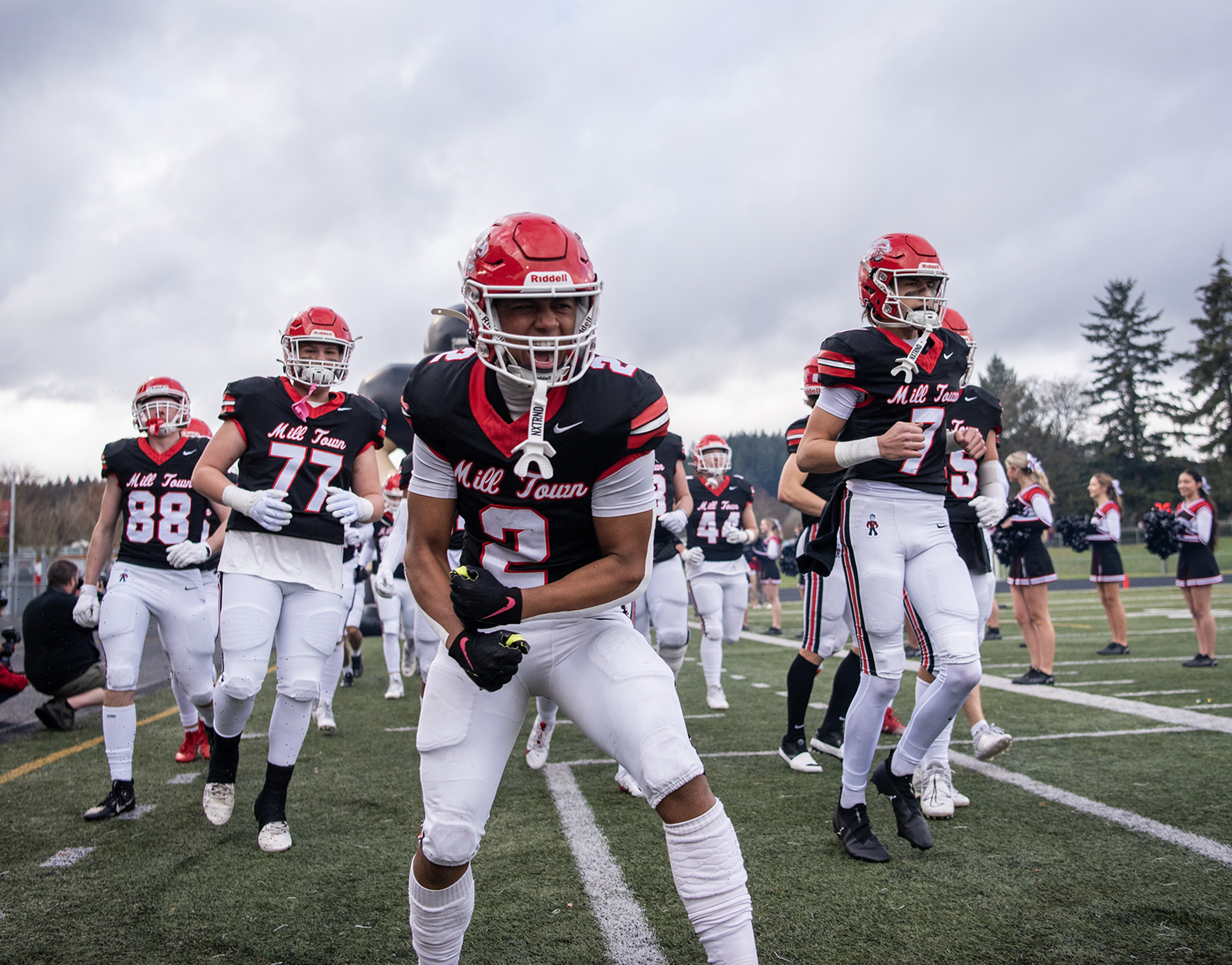 Camas senior Titan Brody (2) leads the team out of the tunnel Saturday, Nov. 23, 2024, before the Papermakers’ quarterfinal playoff game against Arlington at Doc Harris Stadium in Camas.