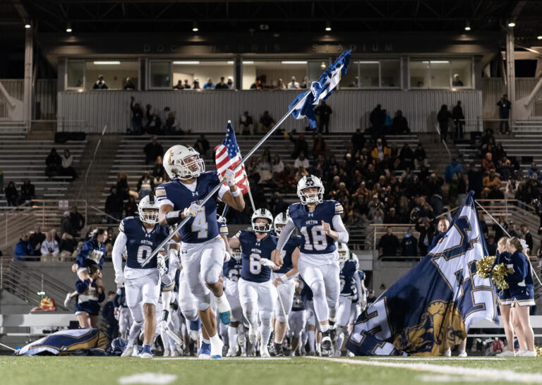 Seton Catholic takes the field Saturday, Nov. 23, 2024, before the Cougars’ 42-41 win against Life Christian Academy in the 1A State Football Playoff quarterfinals at Doc Harris Stadium in Camas.