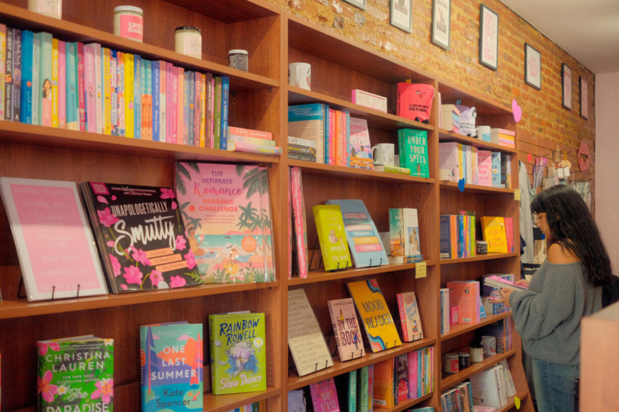 A customer browses the romance selections at Kiss &amp; Tale in Collingswood, N.J.