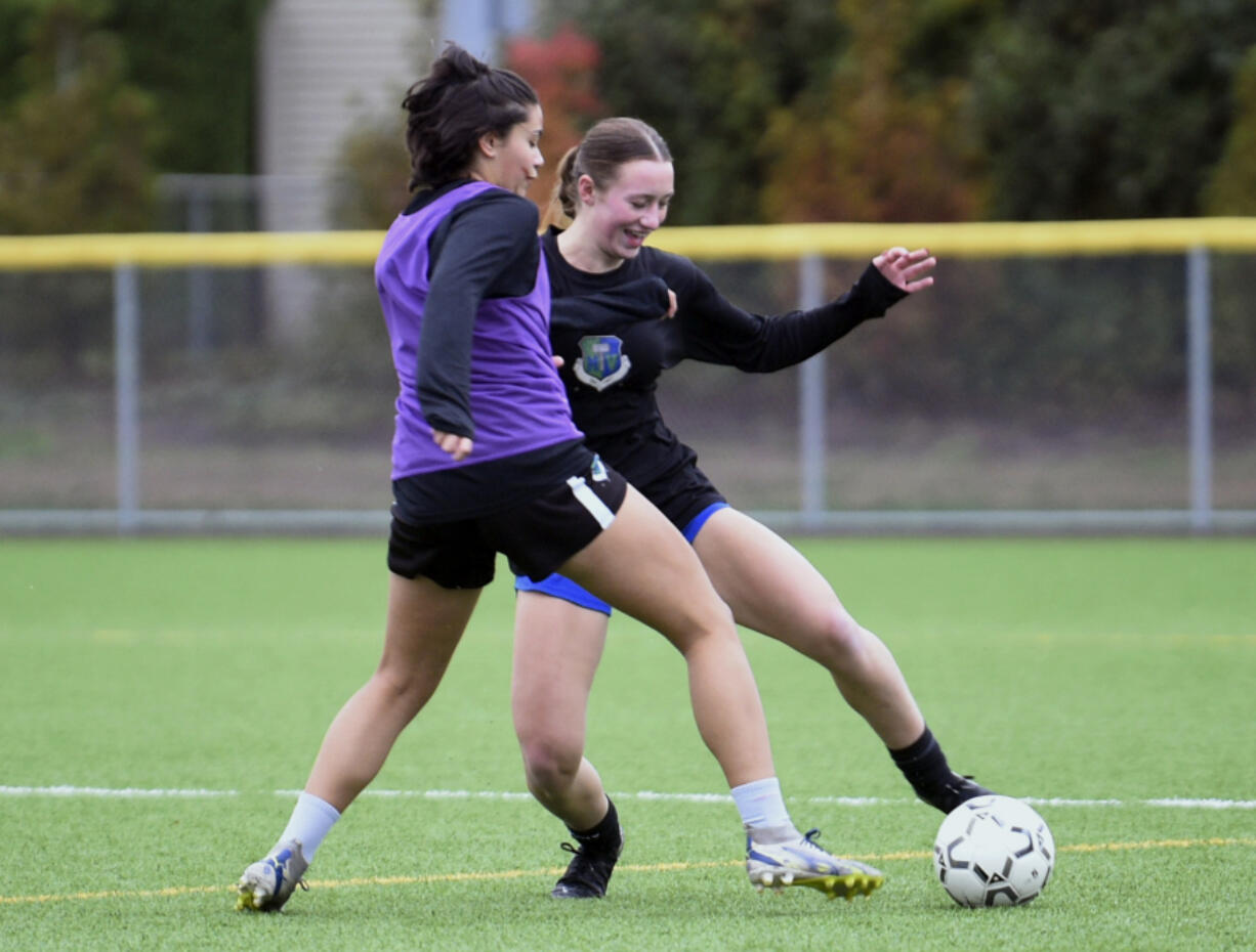 Mountain View junior Teaghan Irvin, right, dribbles the ball against teammate Ana Garling in a drill during a practice on Thursday, Oct. 31, 2024, at Mountain View High School.