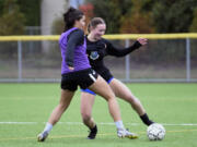 Mountain View junior Teaghan Irvin, right, dribbles the ball against teammate Ana Garling in a drill during a practice on Thursday, Oct. 31, 2024, at Mountain View High School.