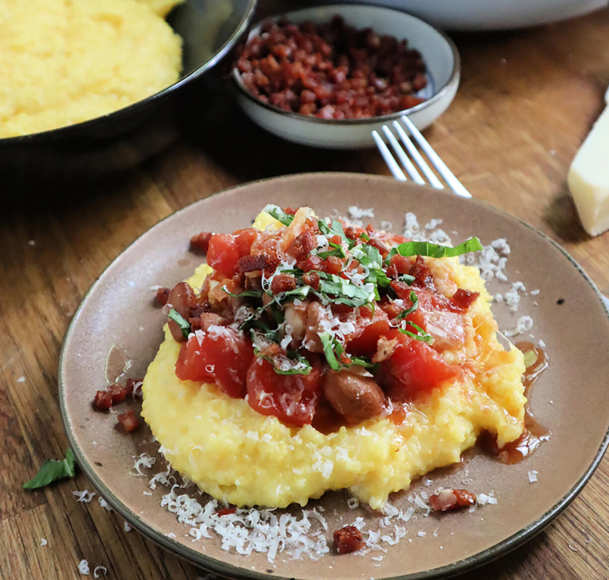 Cranberry beans simmered with tomato are a perfect match for a soft bed of cheesy polenta.