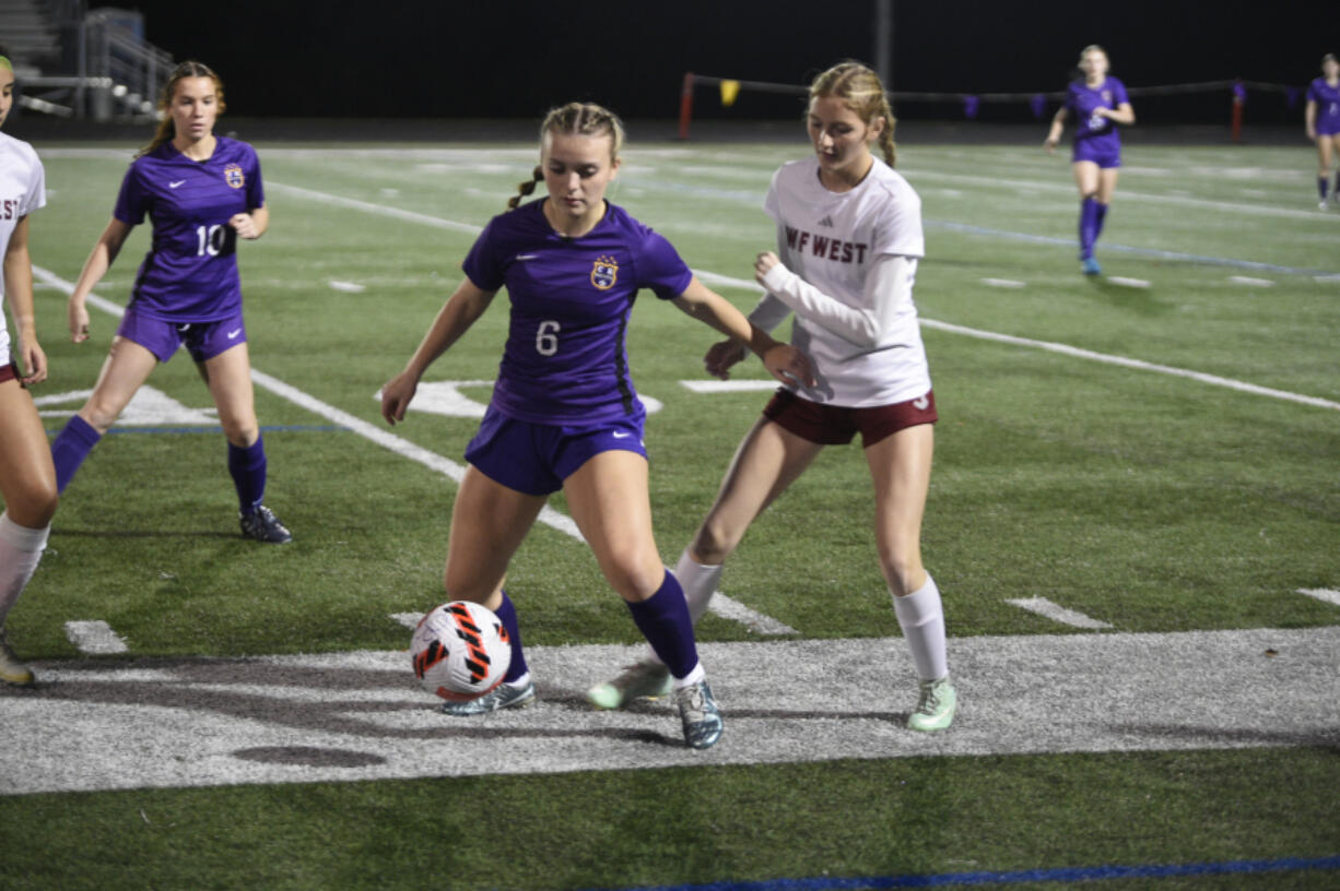 Columbia River forward Ivy Henderson controls the ball against W.F. West defender Ashlen Gruginski during a Class 2A girls soccer District 4 semifinal match on Wednesday, Nov. 6, 2024 at Columbia River High School.