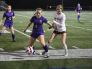 Columbia River forward Ivy Henderson controls the ball against W.F. West defender Ashlen Gruginski during a Class 2A girls soccer District 4 semifinal match on Wednesday, Nov. 6, 2024 at Columbia River High School.