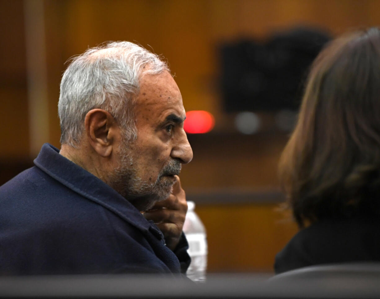 Viktor Pell looks over at his translator Oct. 28 during opening statements in the civil wrongful death trial filed by the family of Effie Entezari, who was killed in 1989. They believe the killer is Pell, the defendant in the trial. Entezari&rsquo;s husband, Mike Entezari, was previously convicted of her killing. He served 16 of his 25-year sentence before being released for good behavior and maintained his innocence for the rest of his life, according to the family.