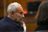 Viktor Pell looks over at his translator Oct. 28 during opening statements in the civil wrongful death trial filed by the family of Effie Entezari, who was killed in 1989. They believe the killer is Pell, the defendant in the trial. Entezari&rsquo;s husband, Mike Entezari, was previously convicted of her killing. He served 16 of his 25-year sentence before being released for good behavior and maintained his innocence for the rest of his life, according to the family.