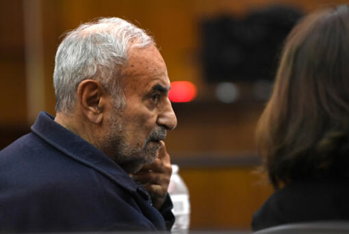 Viktor Pell looks over at his translator Oct. 28 during opening statements in the civil wrongful death trial filed by the family of Effie Entezari, who was killed in 1989. They believe the killer is Pell, the defendant in the trial. Entezari&rsquo;s husband, Mike Entezari, was previously convicted of her killing. He served 16 of his 25-year sentence before being released for good behavior and maintained his innocence for the rest of his life, according to the family.