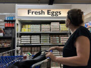 A customer walks by a display of fresh eggs at a grocery store on Sept. 25in San Anselmo, Calif. According to the Bureau of Labor Statistics, egg prices have surged over 28 percent in August largely due to avian influenza (HPAI), also known as bird flu. Nearly 101 million birds have been impacted by bird flu since 2022 which has significantly lowered the number of eggs being produced.