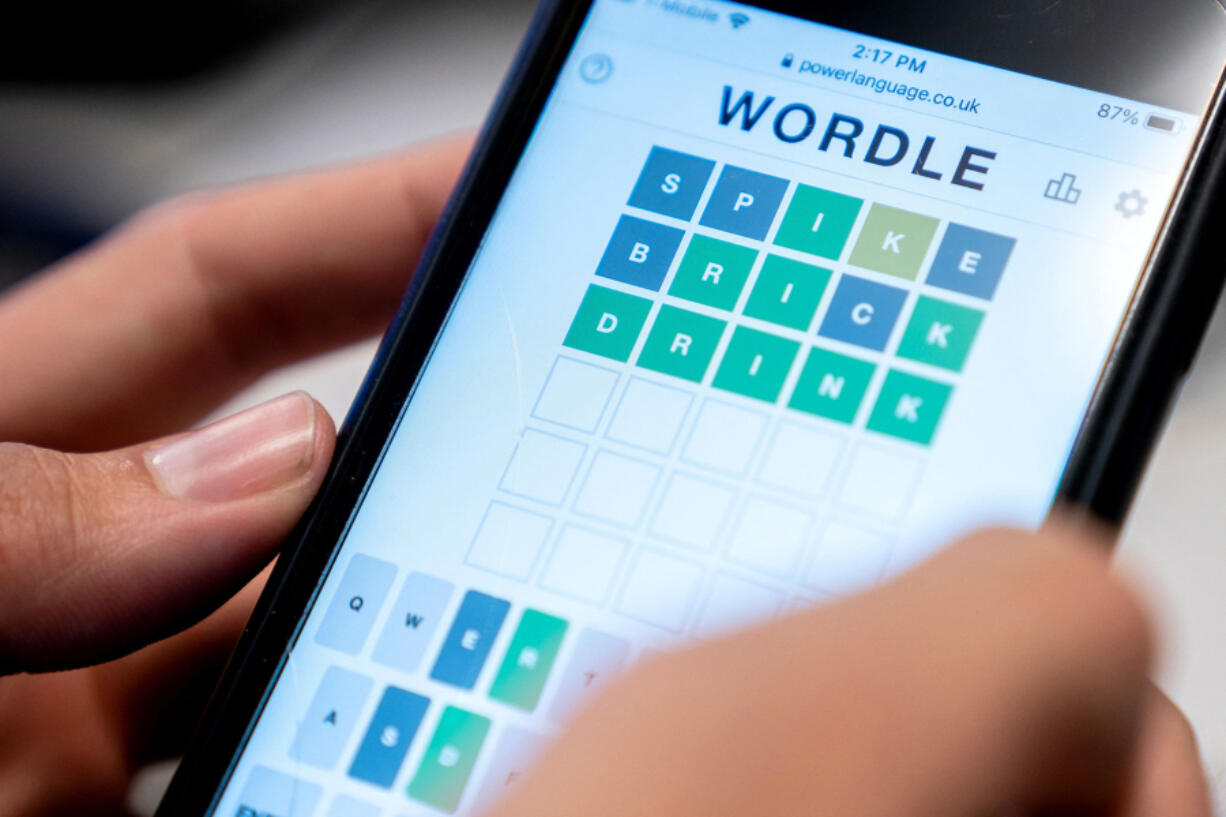 A person plays online word game &ldquo;Wordle&rdquo; on a mobile phone Jan. 11, 2022, in Washington.