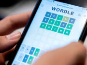 A person plays online word game &ldquo;Wordle&rdquo; on a mobile phone Jan. 11, 2022, in Washington.