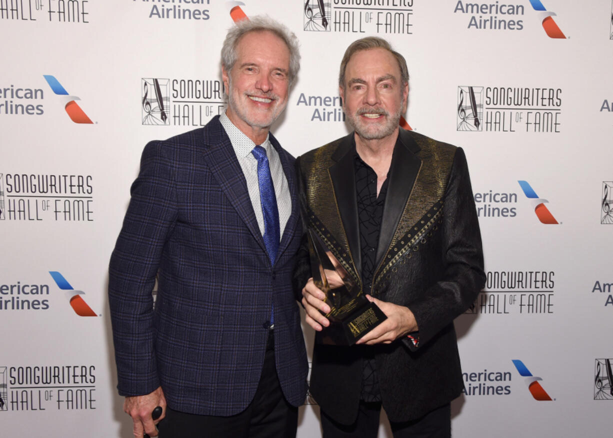 Bob Gaudio, left, and Neil Diamond pose backstage during the Songwriters Hall of Fame 49th Annual Induction and Awards Dinner at New York Marriott Marquis Hotel on June 14, 2018, in New York.